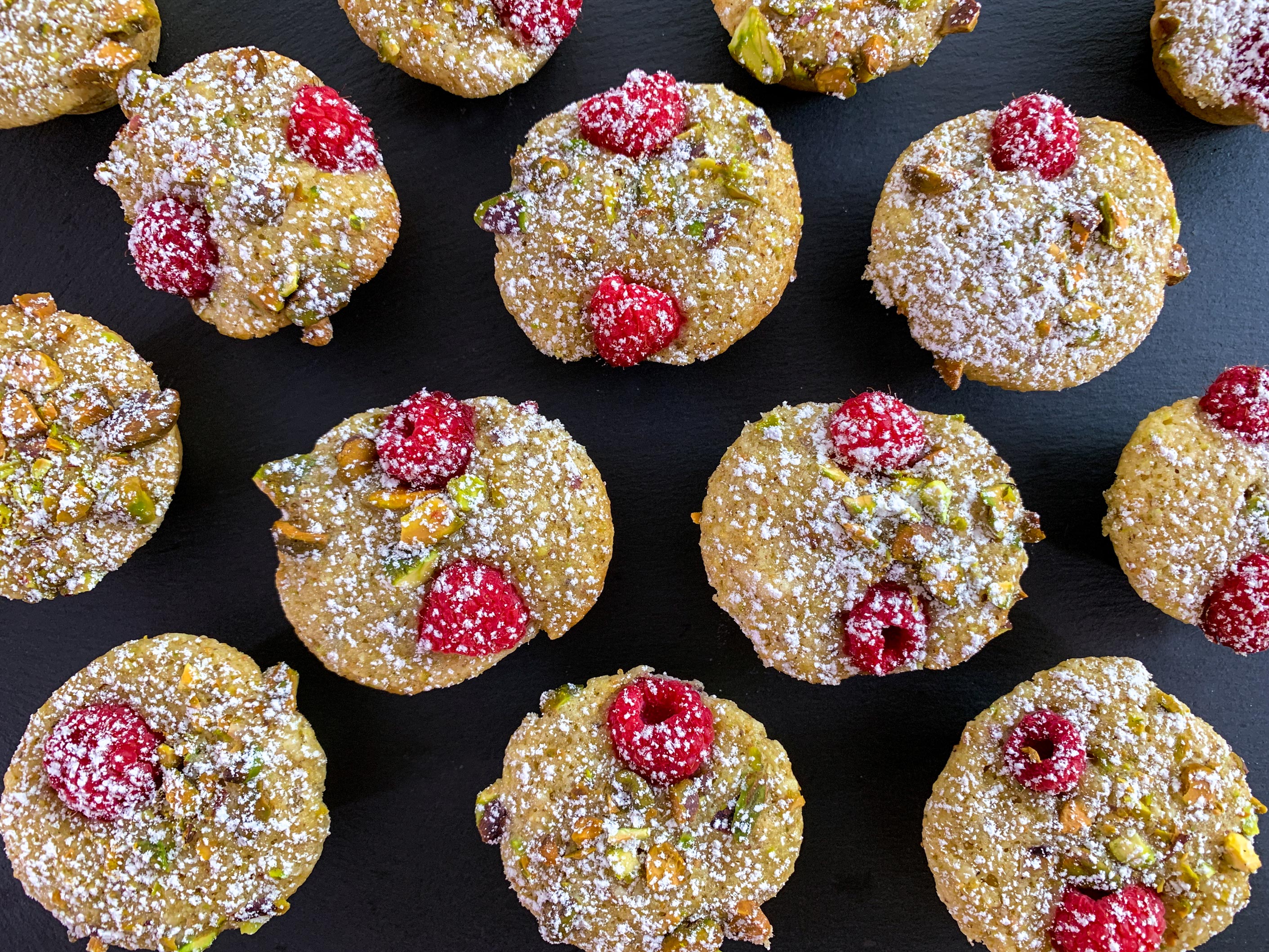 Overhead view of the friands, dusted with icing sugar