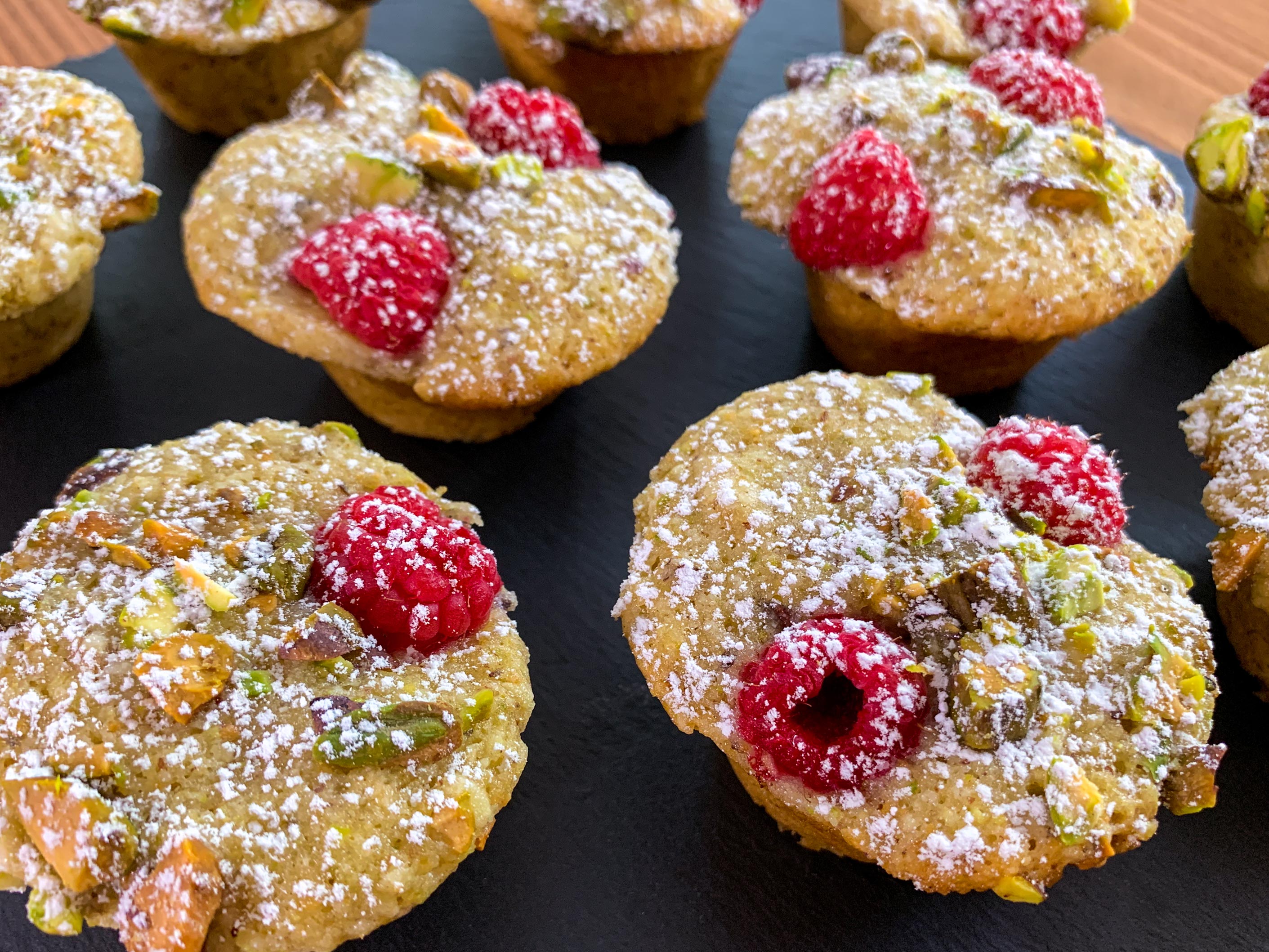 Close up of friands dusted with icing sugar