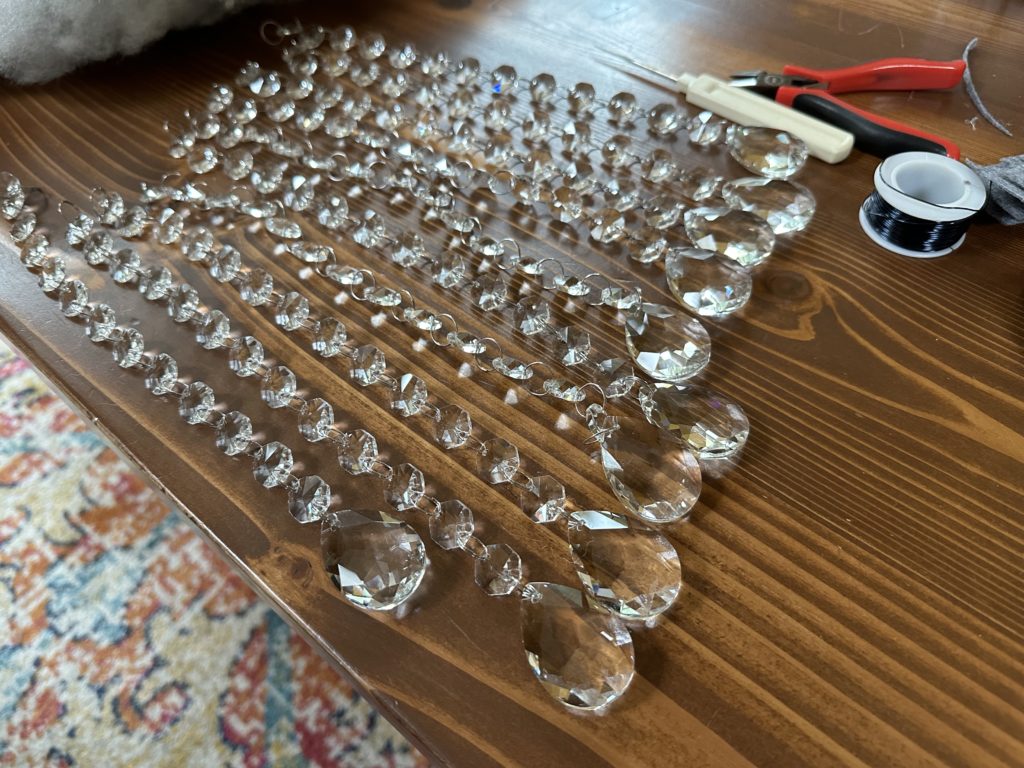 Chandelier crystals laying on the table.
