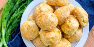 cheddar cheese and dill puffs on a plate