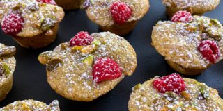 Close up of friands dusted with icing sugar